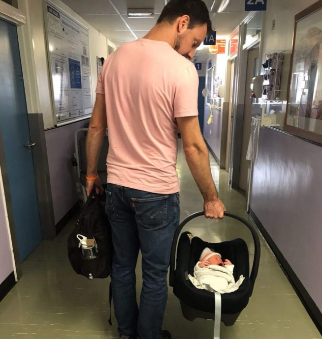 Simon with son bed, leaving hospital