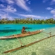 A boy canoeing in the ocean - Papua New Guinea