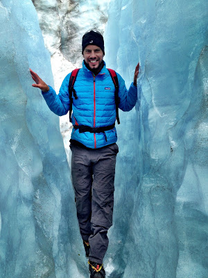 Simon standing in an ice crevasse on the Fox glacier, New Zealand