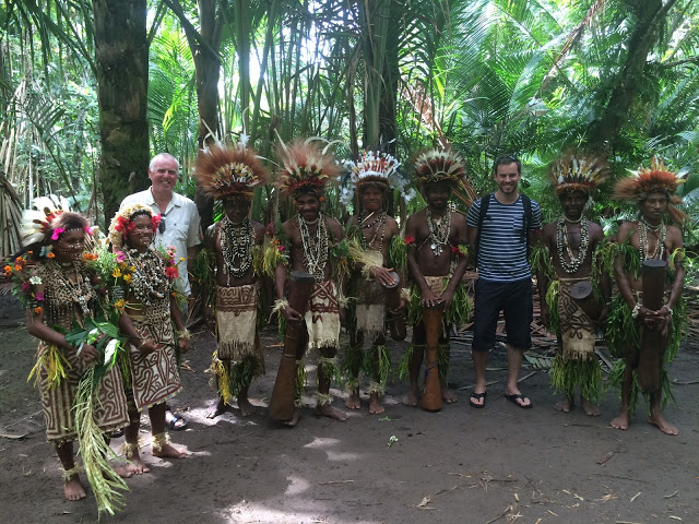 Simon Heyes with a village tribe near Tufi, Papua New Guinea