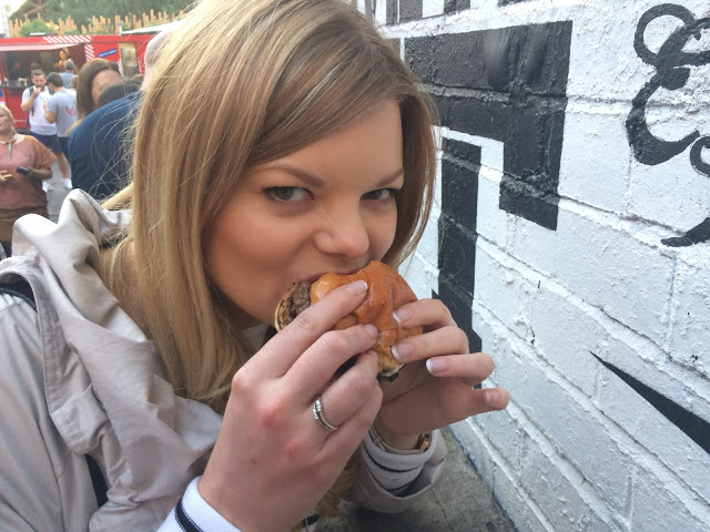 Claire eating the Smokestak US. vs. UK beef patty - National Burger Day 2015