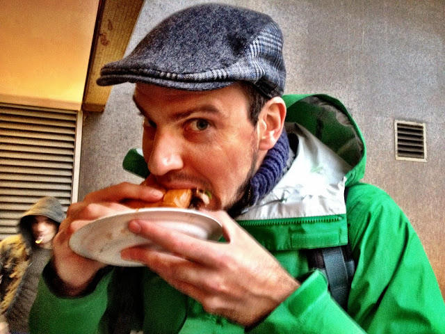 Devouring a duck brioche topped with blue cheese - Real Food Market, South Bank, London