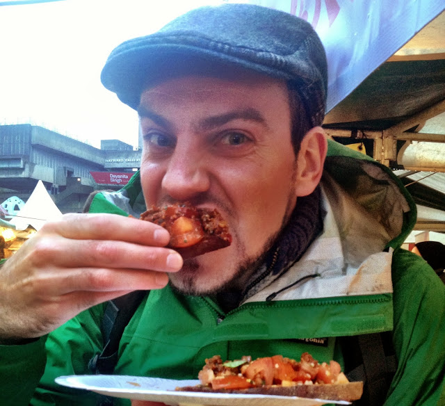 Simon eating bruschetta at the Real Food Market