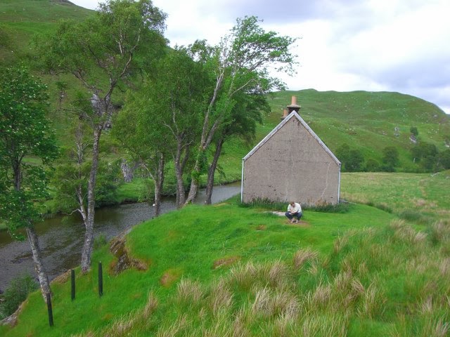 A bothy next to a river in Scotland