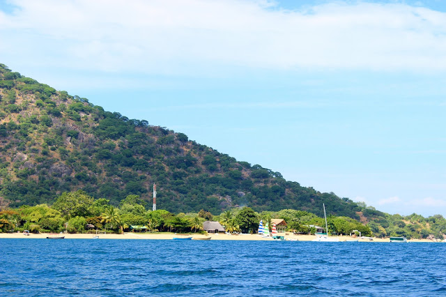 The view of Cape McClear from Lake Malawi. Can you spot Danforth's colourful sails in the background?