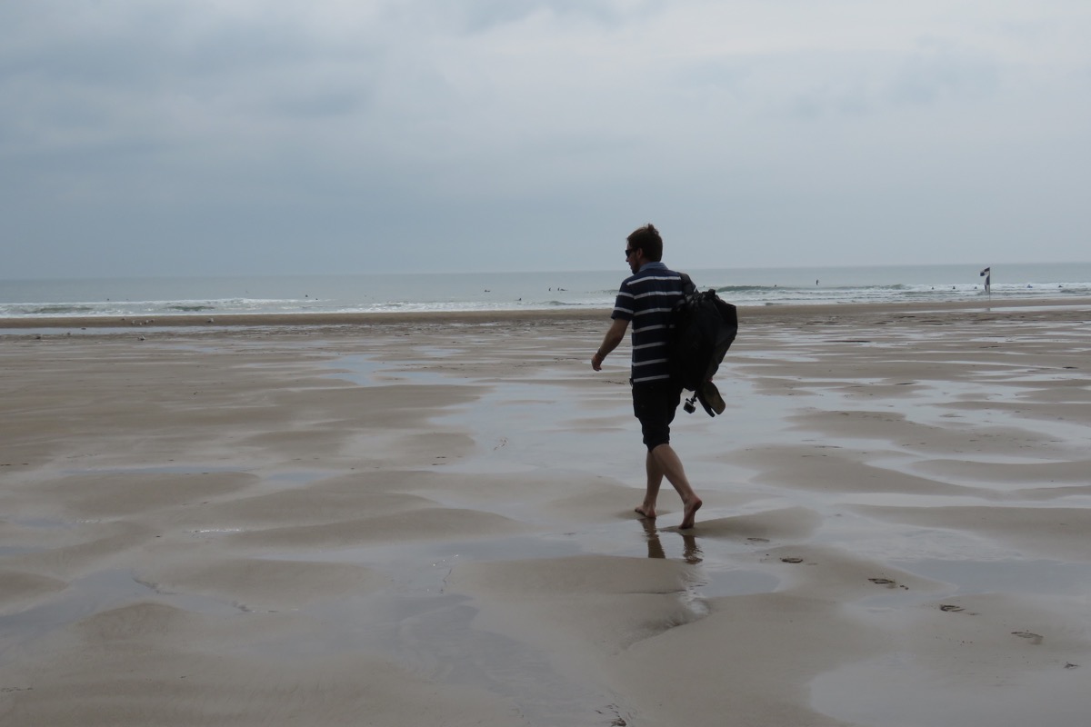Simon walking on Croyde Bay beach, North Devon
