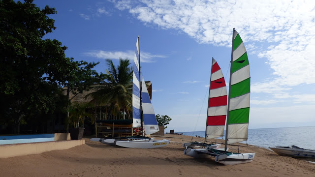 Sailing boats on the golden sand shore of Lake Malawi - Danforth Yachting