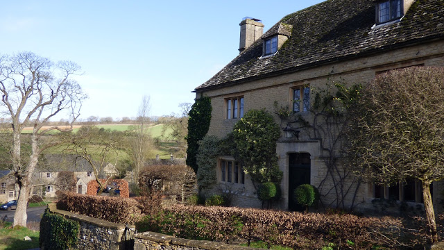 A honey coloured stone property in the village of Upper Slaughter, Cotswolds
