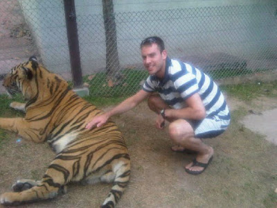 Simon stroking a tiger