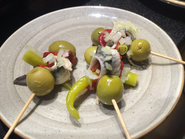 Gilda pintxo - olives, anchovy fillets, spicy peppers and sometimes with onion and olive oil - Basque Country