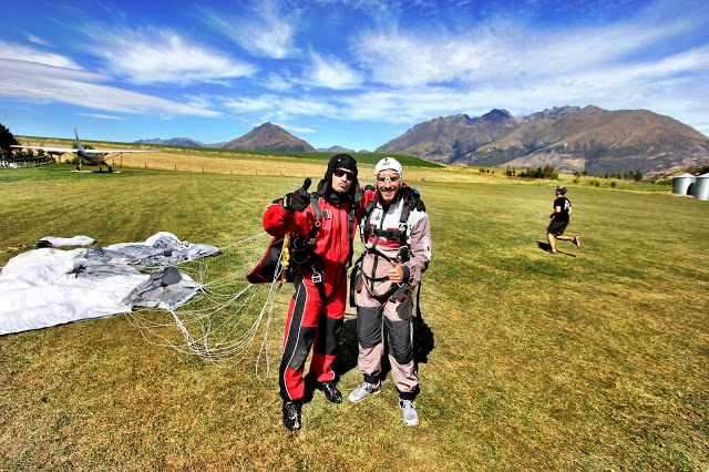 Celebrating with Greg, my tandem master, after skydiving from 15,000ft