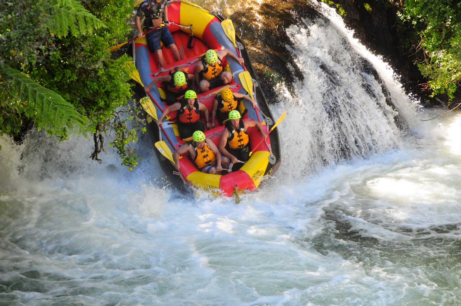 Overcoming the first waterfall - white water rafting in Rotorua, New Zealand