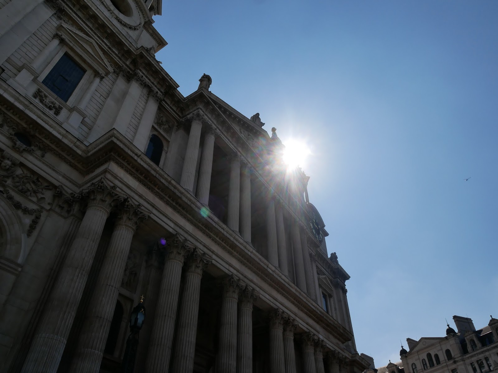The sun beating down on the front of St. Paul's Cathedral, London